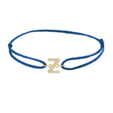 Diamond initial z silk bracelet in 14K yellow gold on blue silk