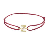Diamond initial z silk bracelet in 14K yellow gold on burgundy silk
