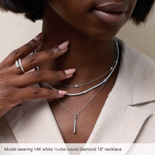 white gold diamond station necklace styled on model
