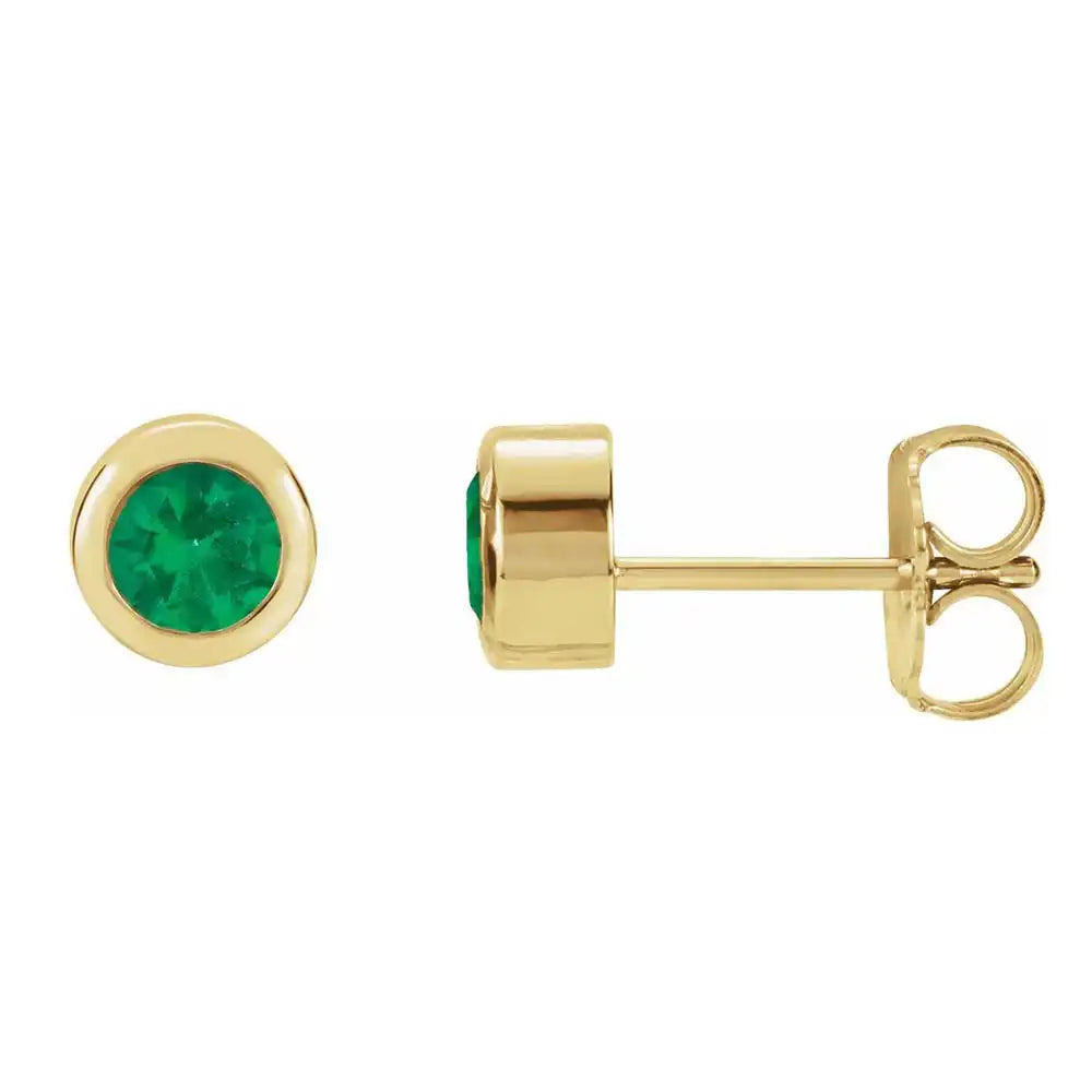 Emerald bezel stud earrings side view in 14K yellow gold