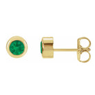 Emerald bezel stud earrings side view in 14K yellow gold