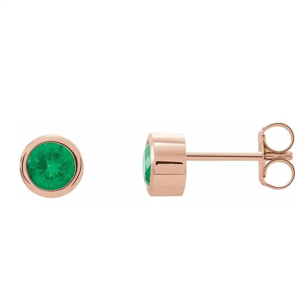 Emerald bezel stud earrings side view in 14K rose gold