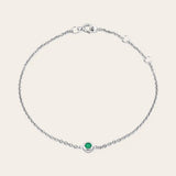 Bezel-set emerald bracelet in 14K white gold, close-up of green stone in bezel rose white variant--14K-white-gold variant--Emerald