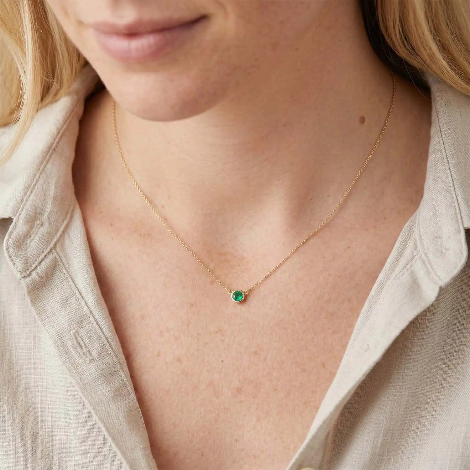 Emerald necklace shown on model