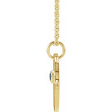 Hand-engraved Capricorn charm paired with sapphire gemstone on gold chain side view