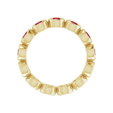 Lab-grown ruby eternity ring in yellow gold, handcrafted and eco-friendly