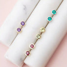 Birthstone stud earrings with natural birthstone bezel-set in 14K gold