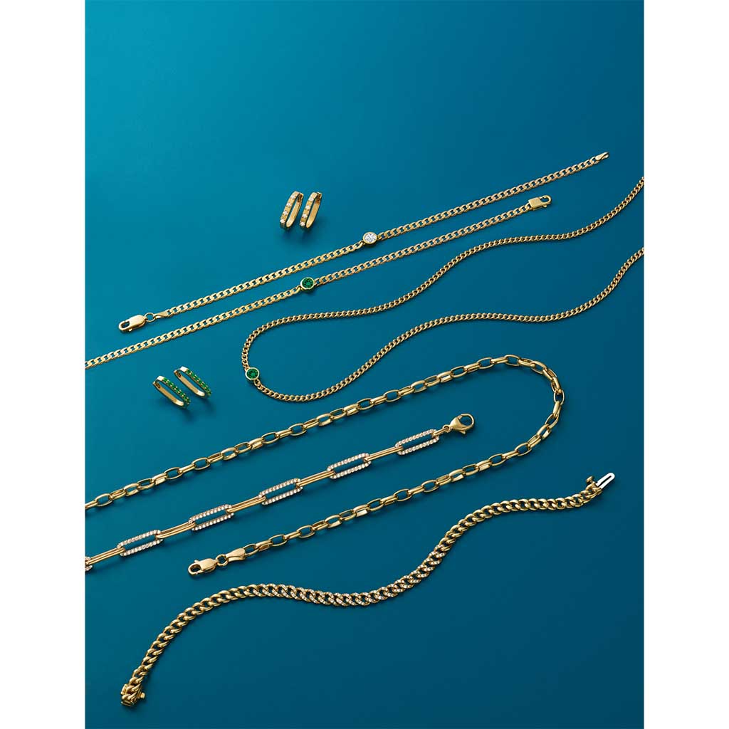 flat editorial shot gemstone gold jewelry