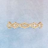 Fluted diamond band with milgrain detail in 14K gold, editorial top view