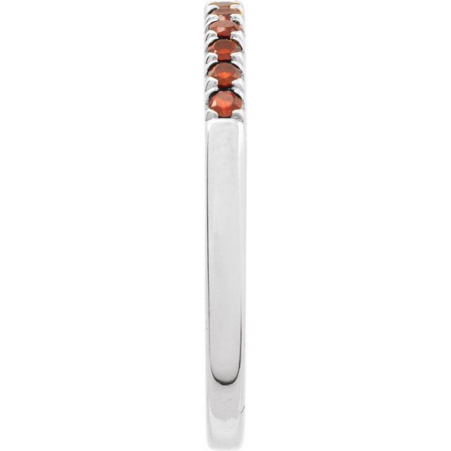 White gold ring with French-set natural garnets side view