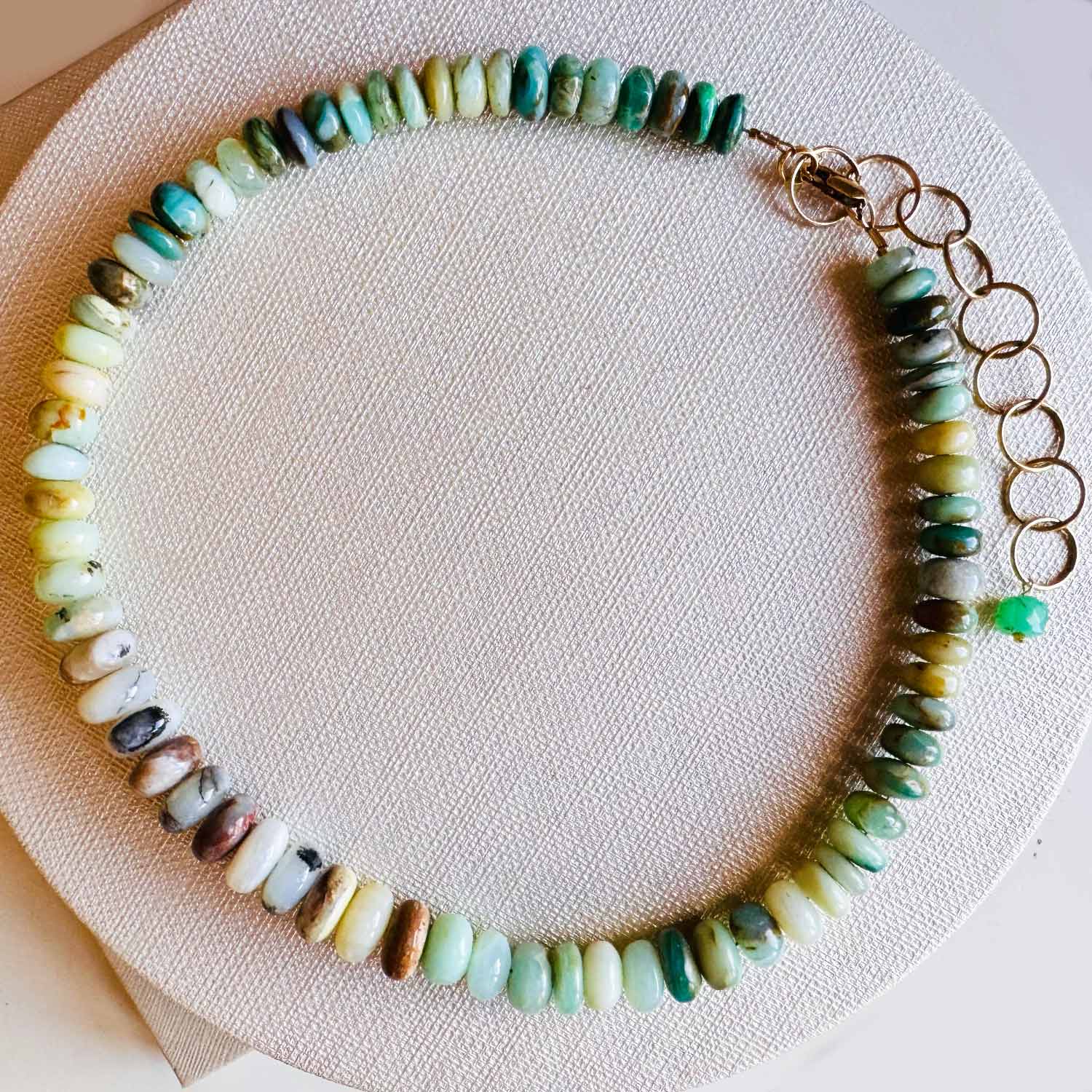 Peruvian opal bead strand necklace, detail of natural color variation in opal stones variant--Opal