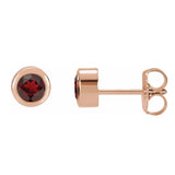 Garnet bezel stud earrings side view in 14K rose gold variant--14K-rose-gold variant--Garnet