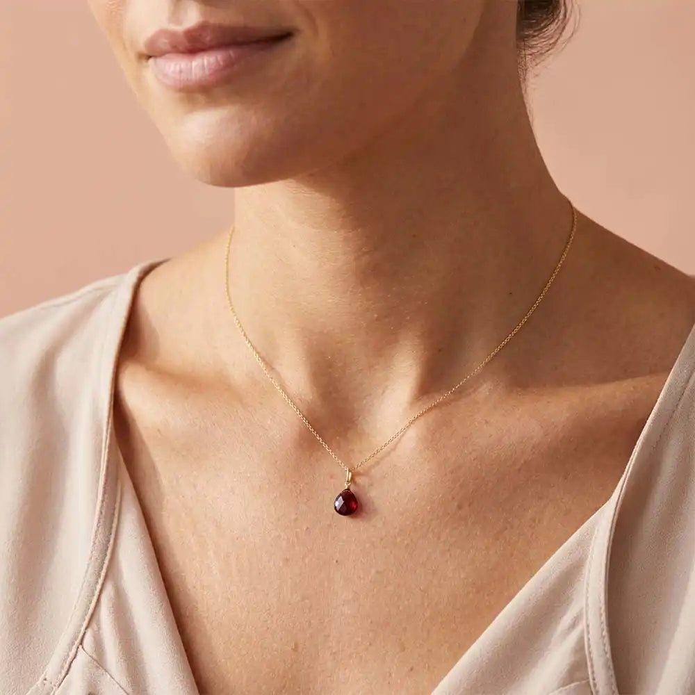 Garnet drop necklace shown on model