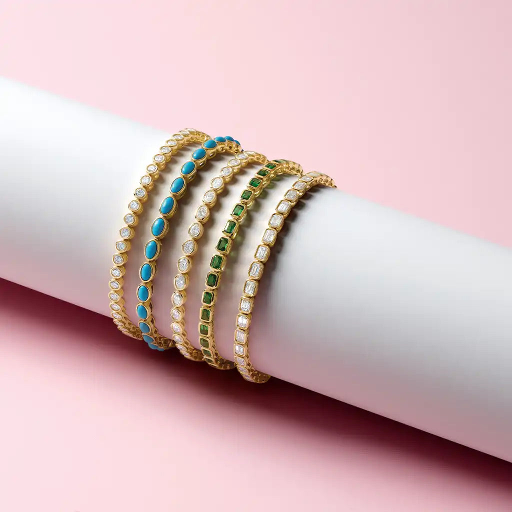 Gemstone tennis bracelet in 14K gold, on wrist