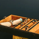 Side view of blue and green cocktail rings