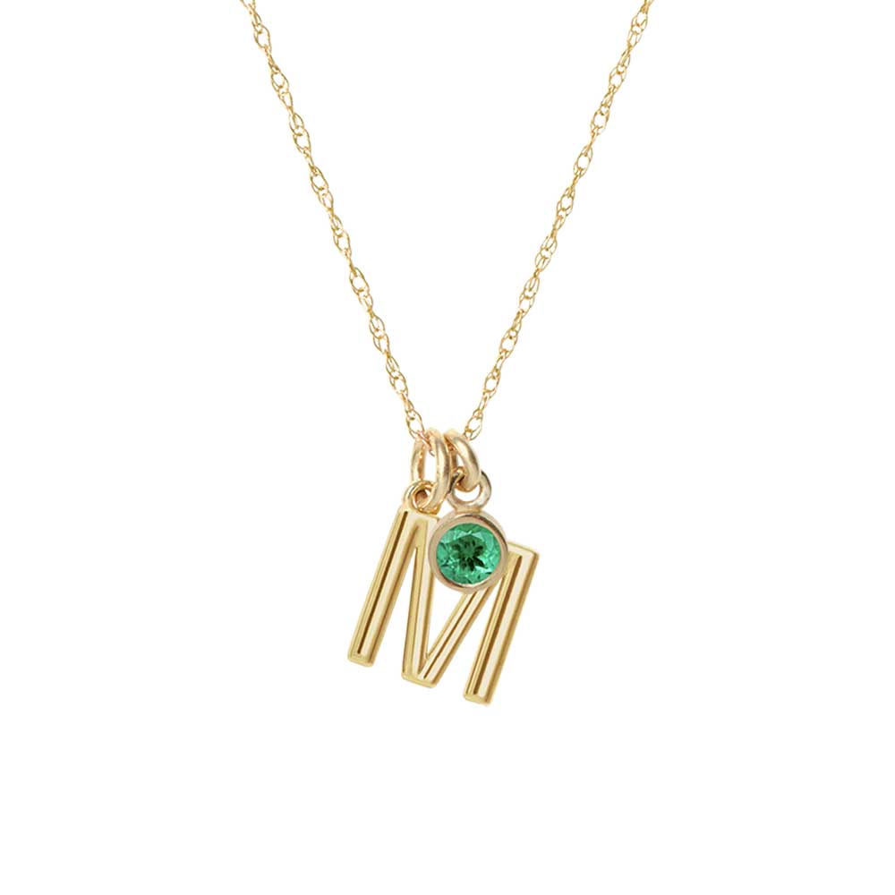 Family initial and birthstone necklace in solid gold.  The letter M with an emerald