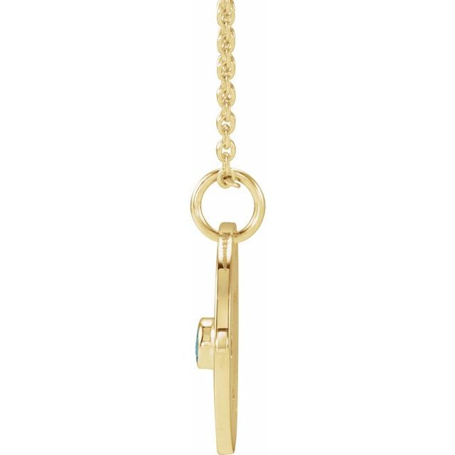Scorpio medallion paired with icy blue zircon gemstone on gold chain side view