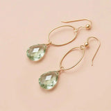 Faceted green amethyst drop earrings in yellow gold fill, pale mint-green gemstone teardrop briolette suspended from slim oval gold link, blush background. all-groups