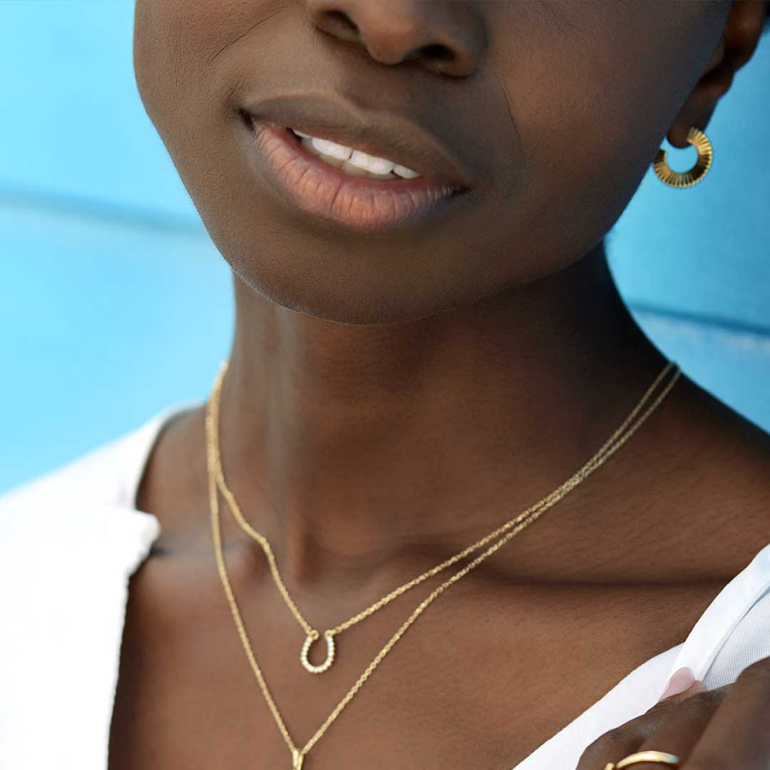 diamond horseshoe necklace in yellow gold on model variant--14K-yellow-gold variant--14K-white-gold variant--14K-rose-gold