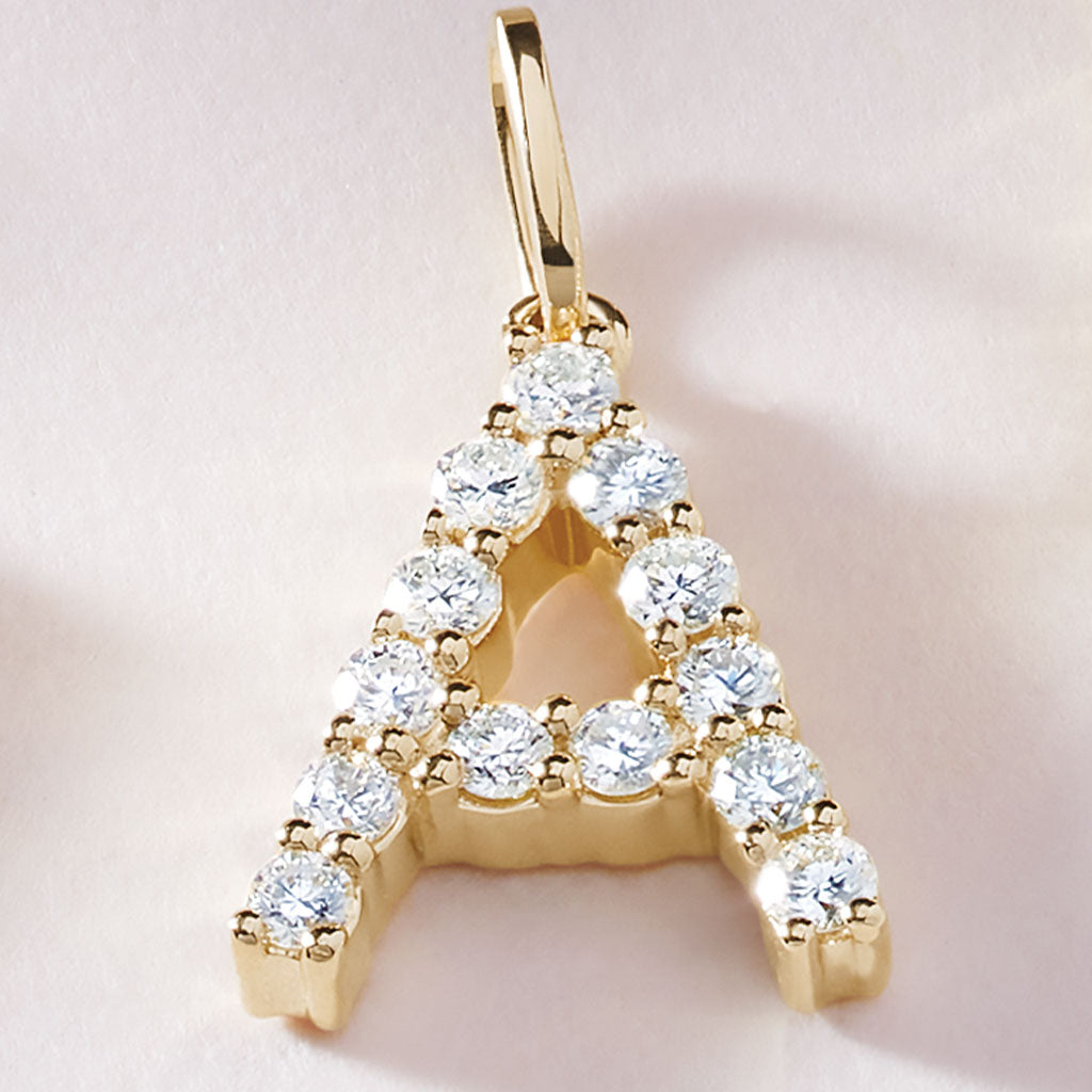 Diamond initial charm in 14K yellow gold