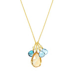 Custom 4 gemstone necklace in gold with blue topaz and citrine stones