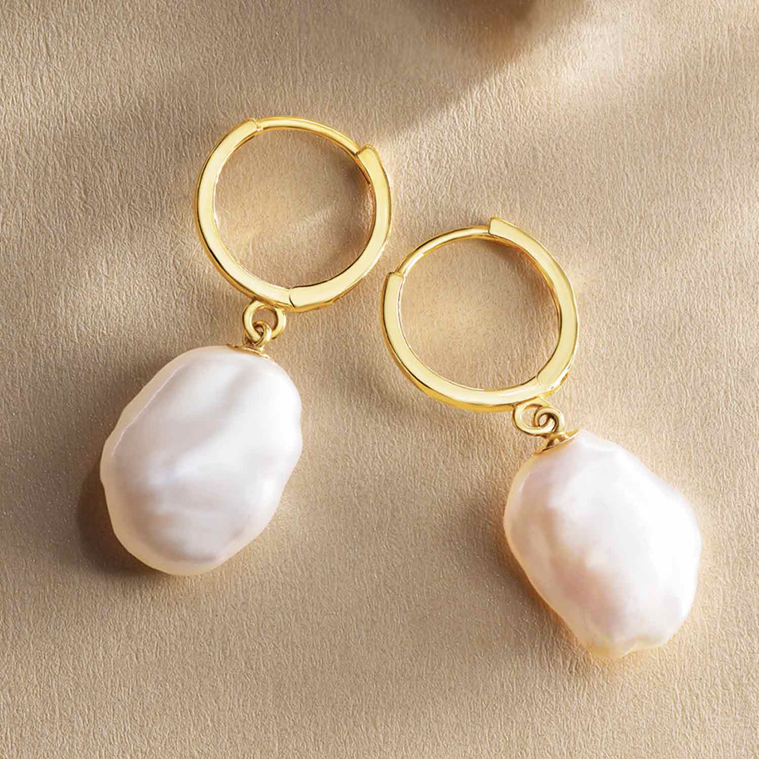 Keshi pearl hoop earrings in 14K gold, editorial styling