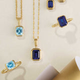 14k yellow gold keyhole chain necklace shown with sapphire pendant