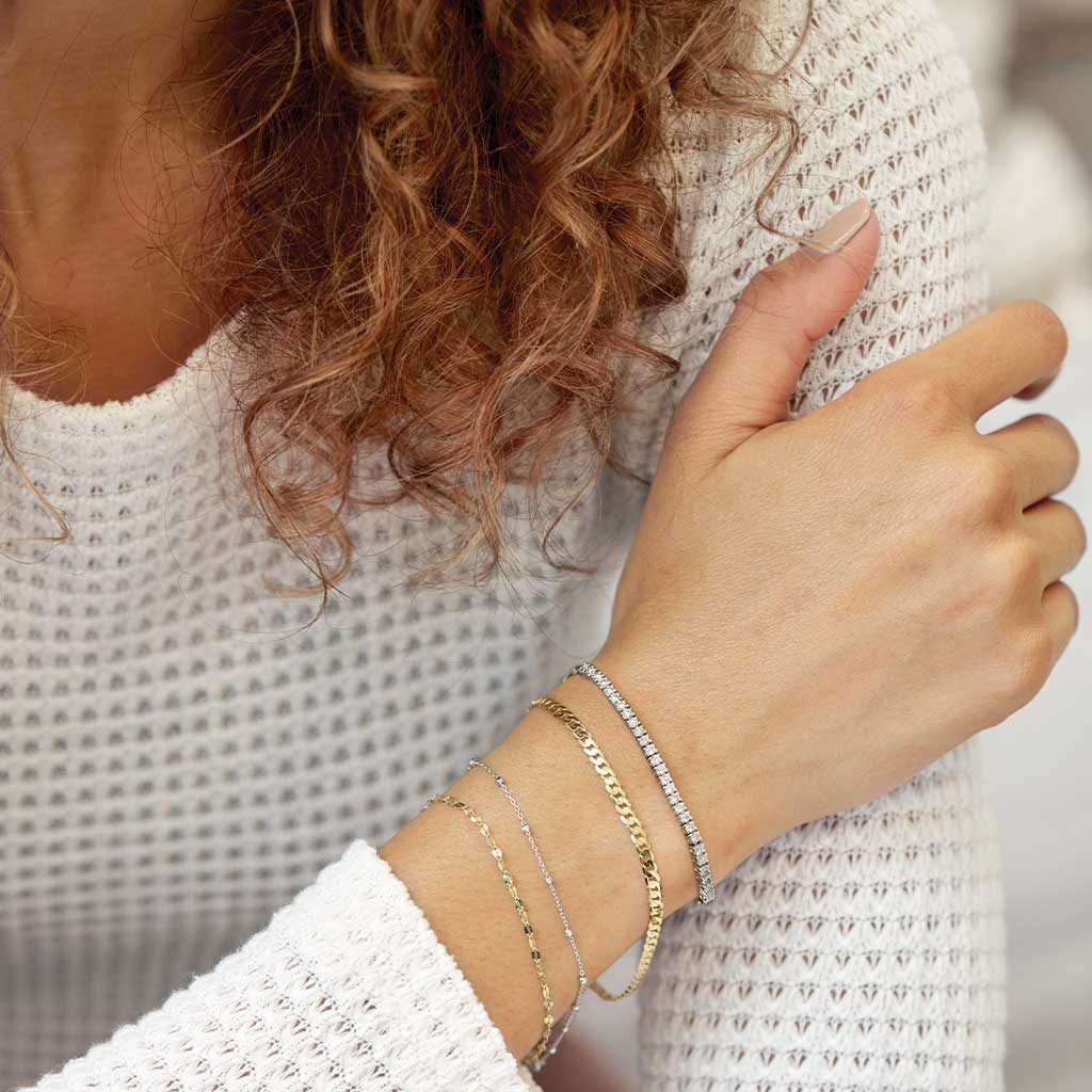 minimalist keyhole chain bracelet yellow gold shown on model