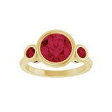 Handmade red ruby ring featuring 8mm center stone and two 3mm round accents