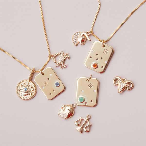 Leo constellation birthstone necklace with peridot and diamonds