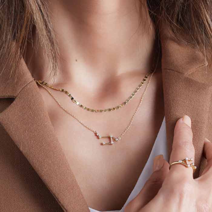 Scorpio zodiac necklace in 14K gold, side angle of diamond setting