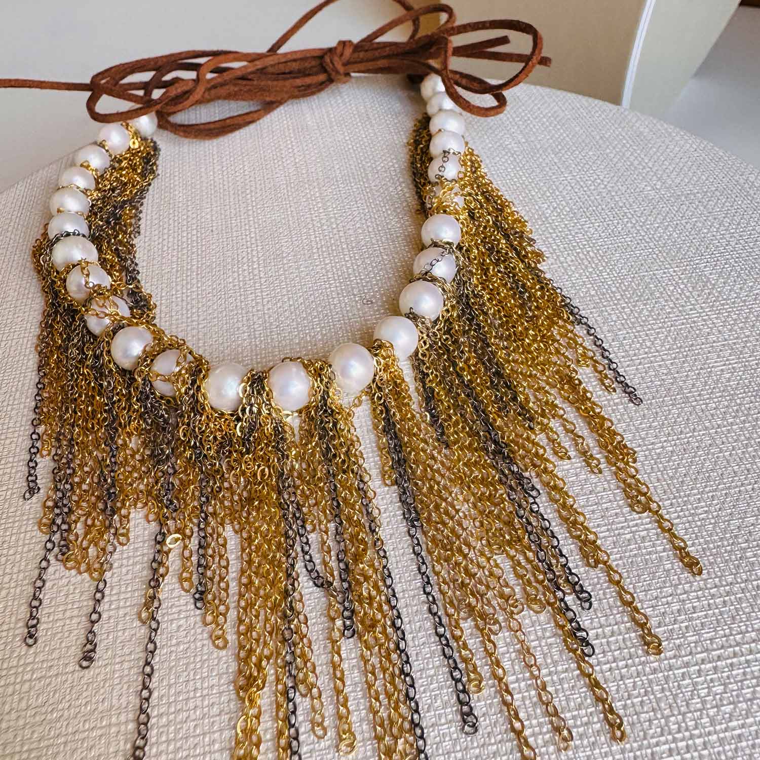 Pearl fringe necklace close-up of hand-knotted chain fringe detail