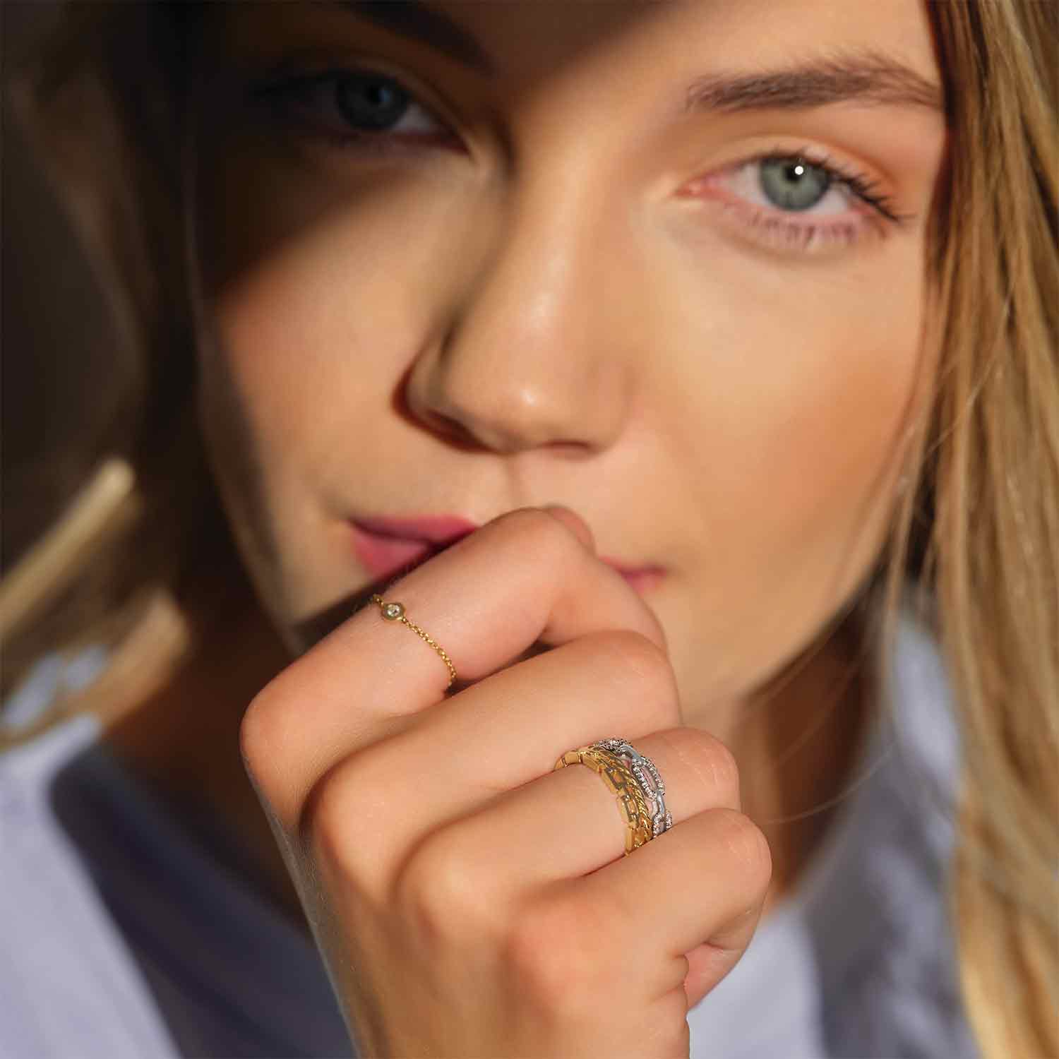 Modern diamond link ring with natural diamonds shown stacked on model