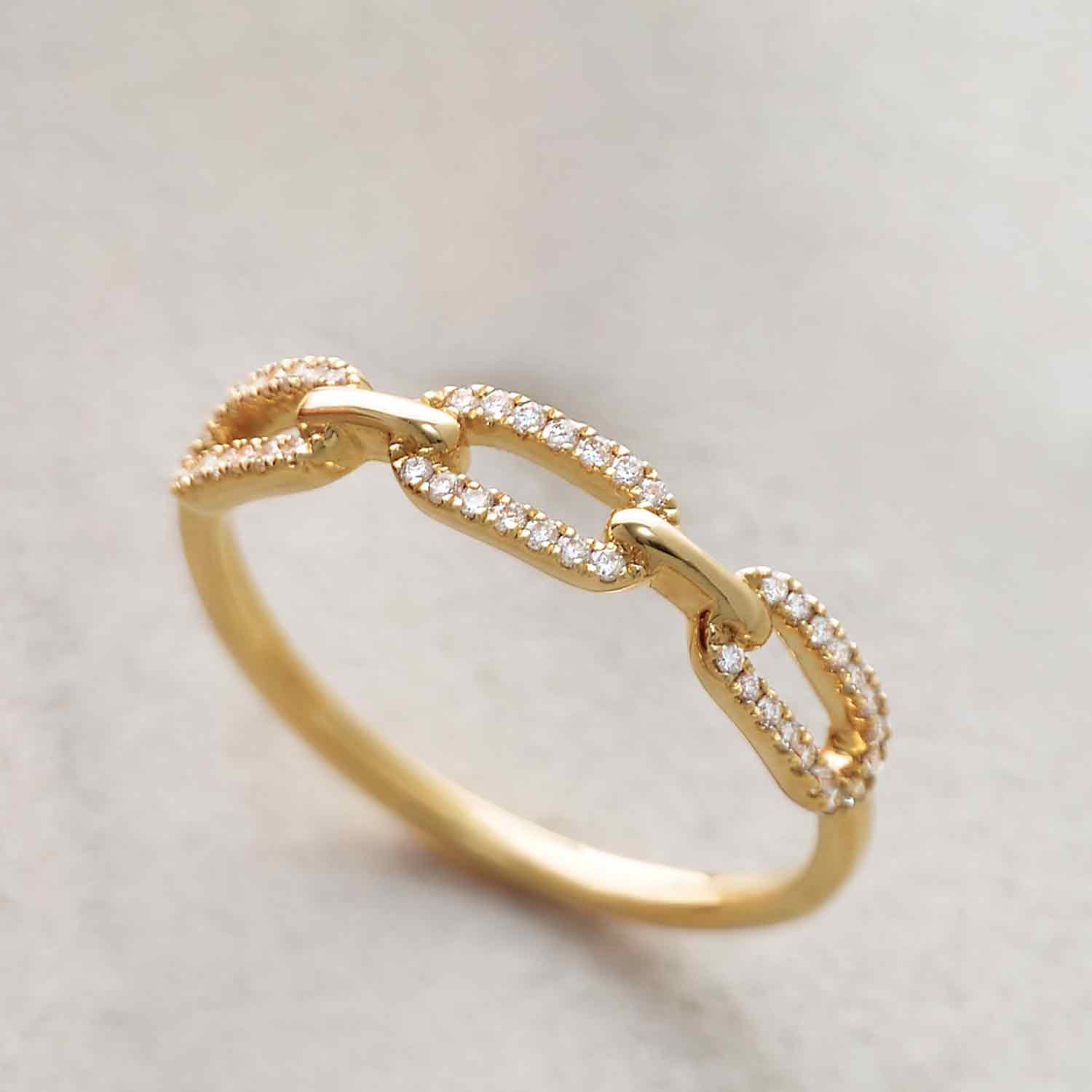 Diamond link ring in 14K yellow gold with diamond accents
