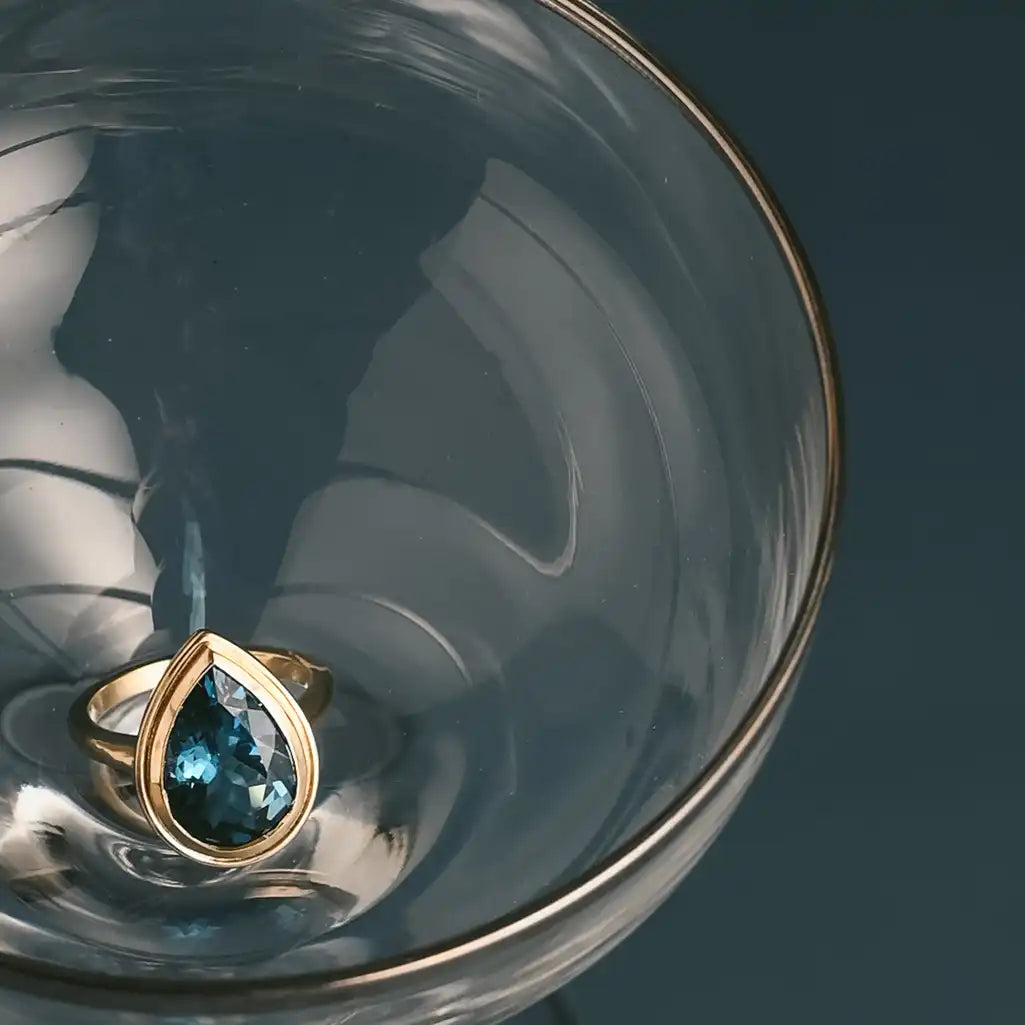 Elegant teardrop London Blue Topaz ring recycled gold
