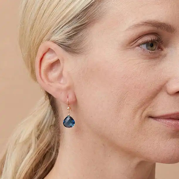 Drop earring in gold-fill shown on model. variant--Gold-fill, variant--Sterling-silver, variant--14K-yellow-gold, variant--14K-white-gold variant--London-Topaz