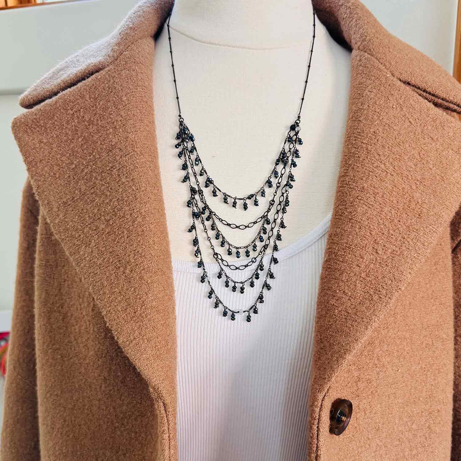 Louise layered necklace with black sapphire, on model showing drape