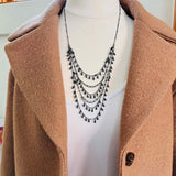 Louise layered necklace with black sapphire, on model showing drape