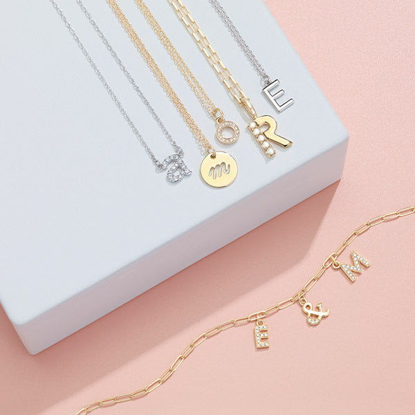 Personalized diamond initial necklace layered look