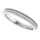 Angled white gold band showing bead detail and prong settings