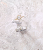 White gold milgrain band styled with mens band and engagement ring