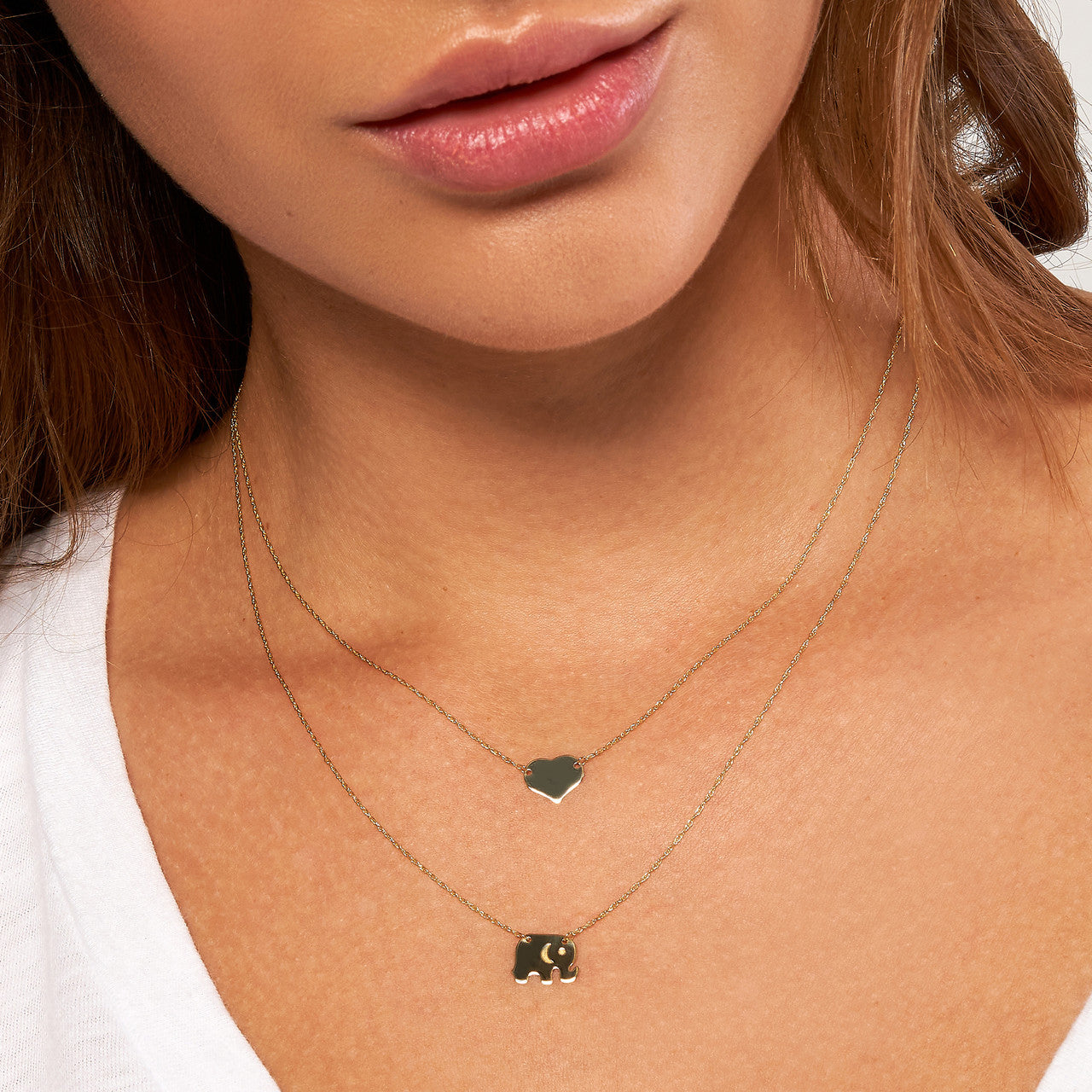 Mini Heart Necklace styled on model, layered with delicate chains for everyday minimalist romantic look.