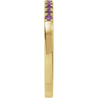 Slim yellow gold band with deep purple amethyst gemstones side view