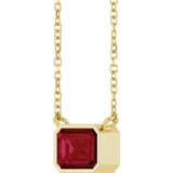 Minimalist east-west ruby necklace on 18-inch chain, close detail of stone variant--14K-yellow-gold