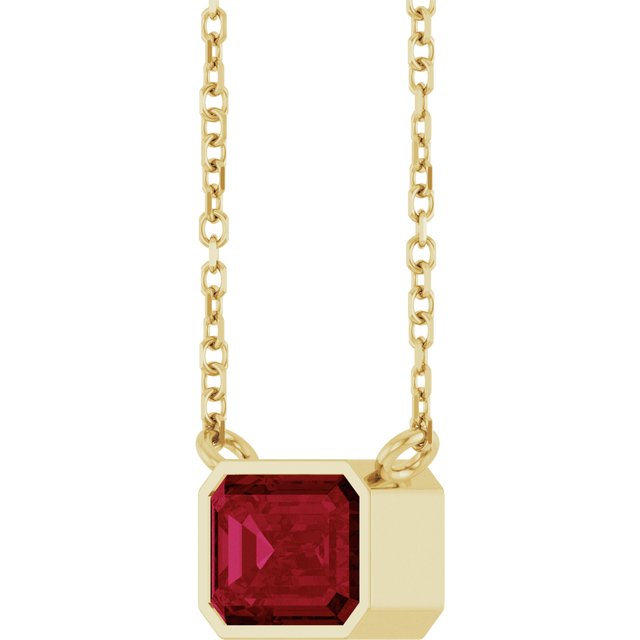 Minimalist east-west ruby necklace on 18-inch chain, close detail of stone variant--14K-yellow-gold