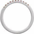 White gold stacking ring with deep red garnets detail view