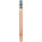 Minimalist stacking band in rose gold with eleven topaz gems