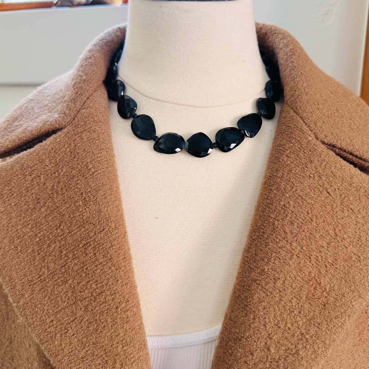 Onyx beaded necklace on model, bold black stone strand with silver accents variant--Onyx