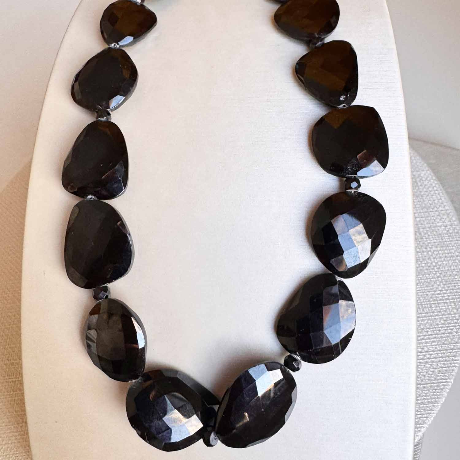 Onyx beaded necklace in sterling silver, close-up of polished black onyx beads variant--Onyx
