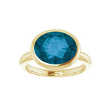 Handmade London blue topaz cocktail ring, horizontal oval setting in recycled gold
